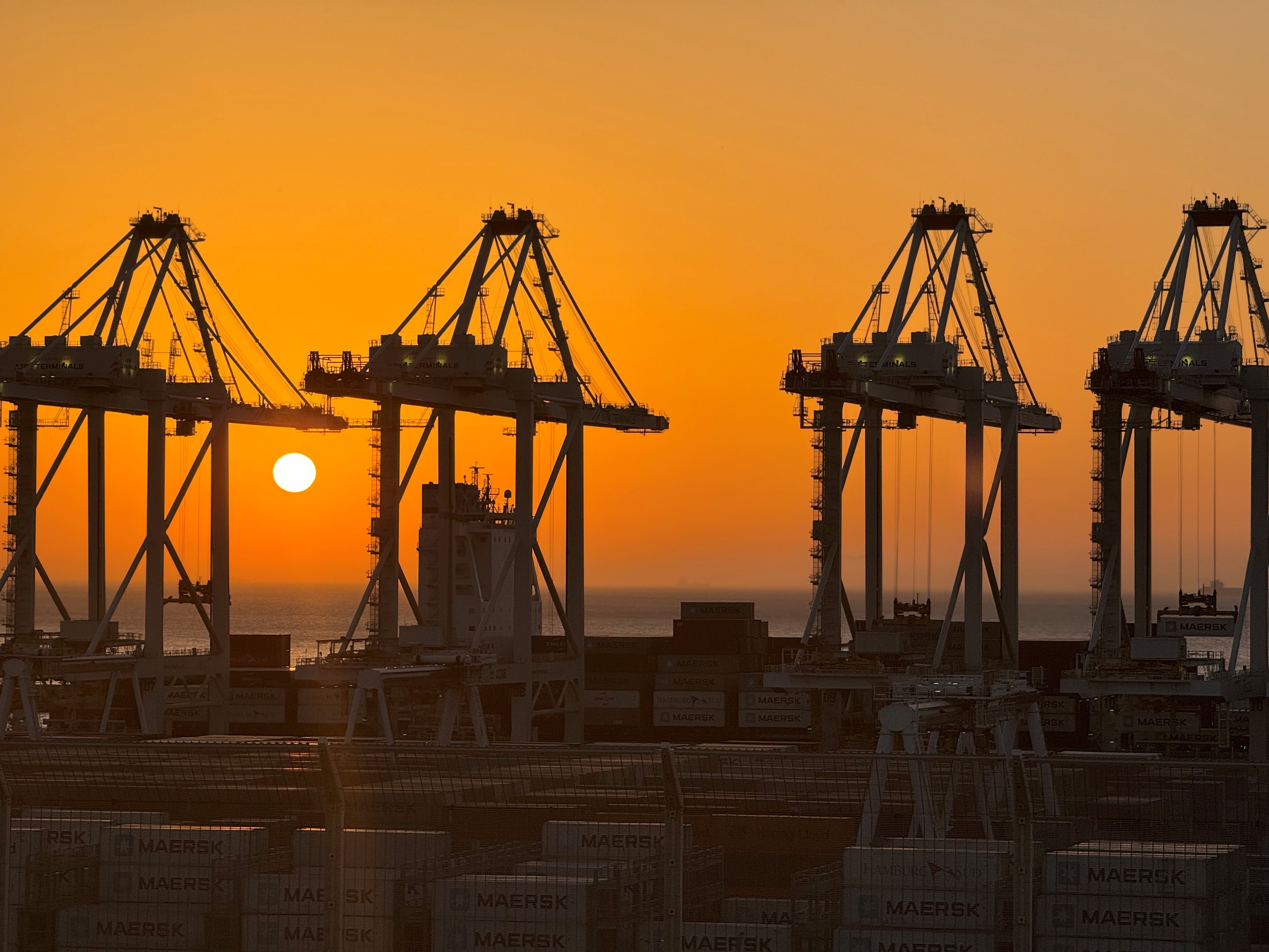 When the sun burns gold, world trade continues.jpg